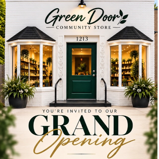 The Green Door Community Store storefront at 1213 Jefferson St, with its green door and plant-filled bay windows